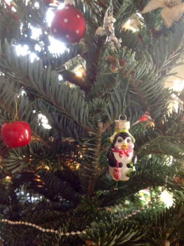 not a pear, but quite pearish with her sequin purse, umbrella and scarf 